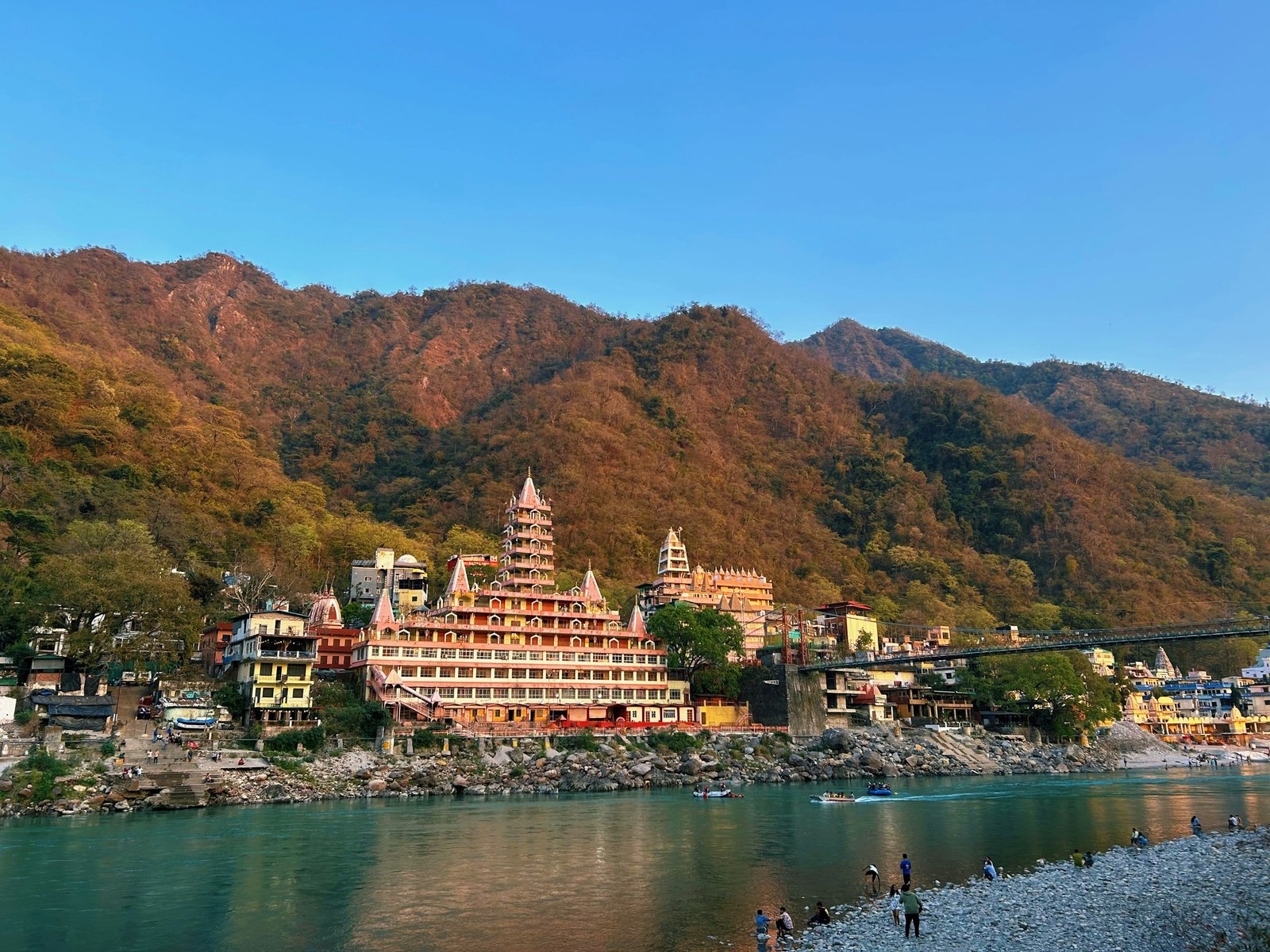 Rishikesh — riverside ashrams on the Ganga at golden hour