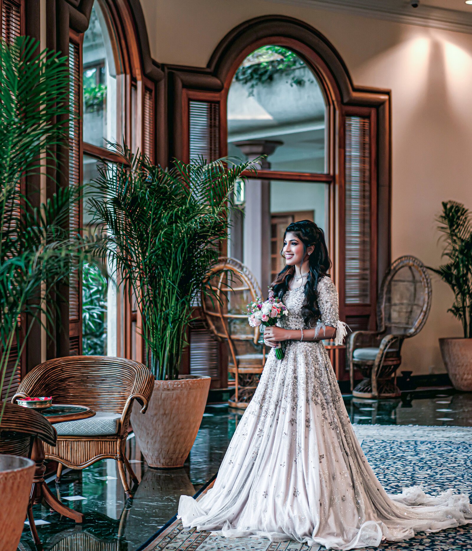 Bride in white at heritage palace lobby