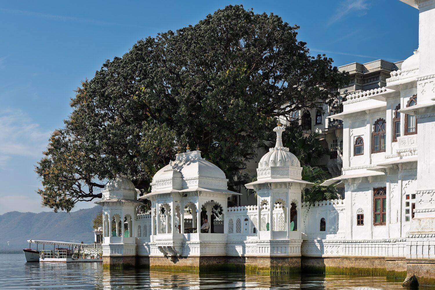 The white marble Taj Lake Palace appearing to float on Lake Pichola