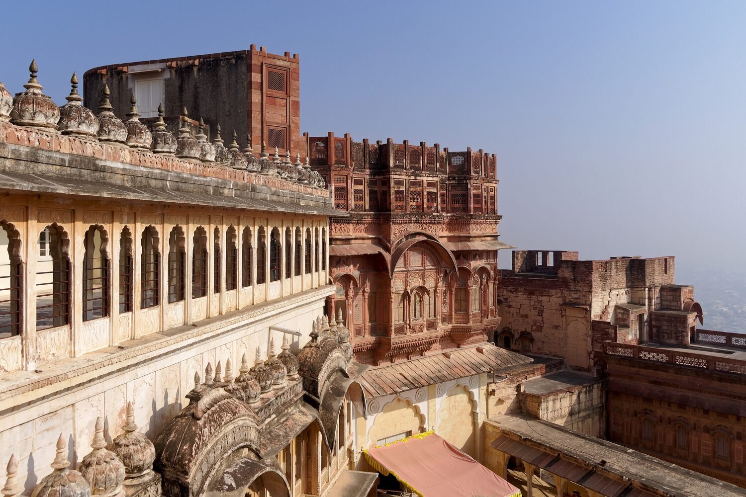 The red sandstone ramparts of Mehrangarh Fort rising high above Jodhpur